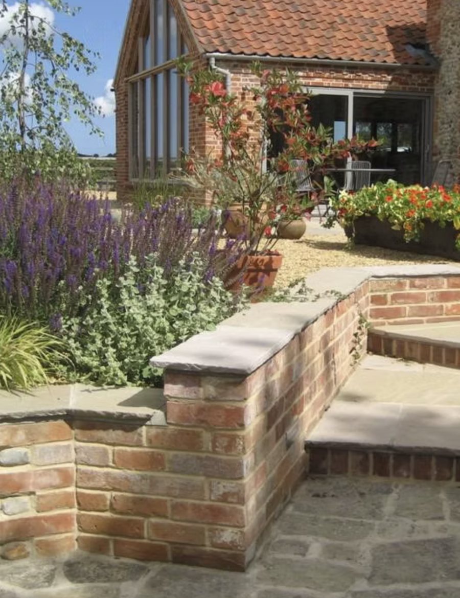 Contemporary Barn Garden in Brick, flint and salvias