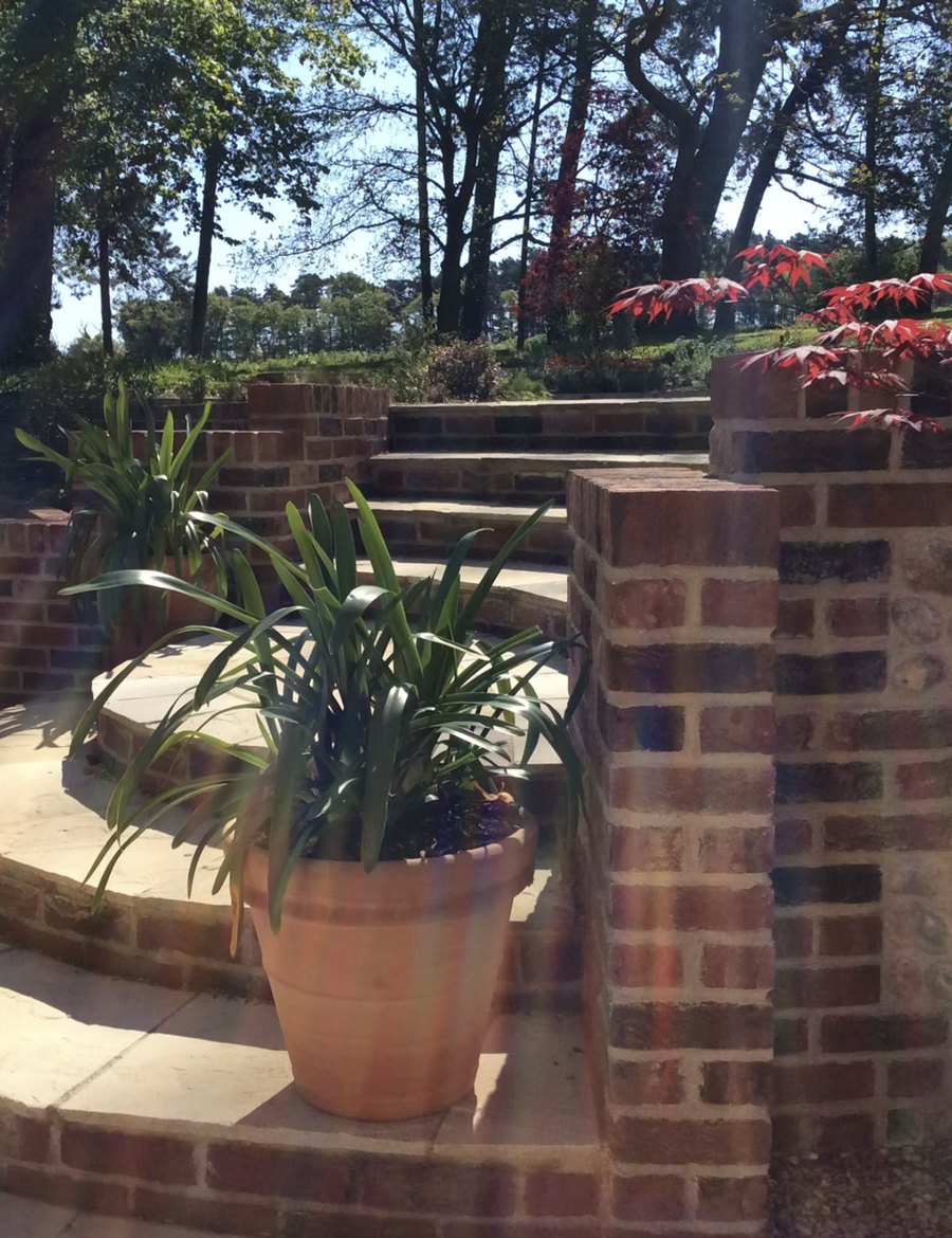Terraced Garden in Brick, flint and curved stone